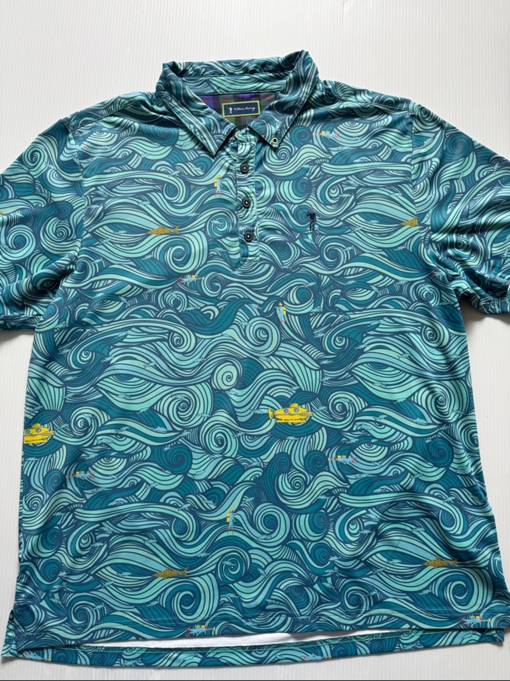 William Murray polo featuring a "The Rough Life" wave pattern.  Men’s size XL